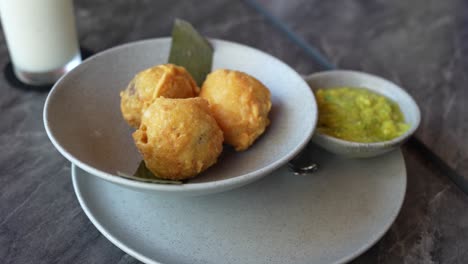 colombian food stuffed potatoes with guacamole appetizer. close up