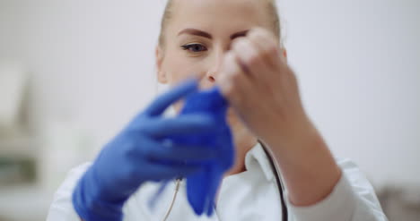 Close-Up-Of-Female-Doctor-Wearing-Gloves-3