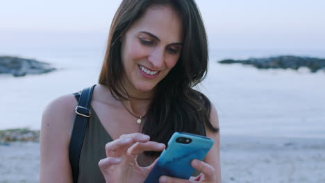 Woman,-tourist-and-typing-with-phone-at-beach