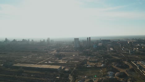 smoggy atmosphere over industrial steel plant in galati, romania. wide aerial shot