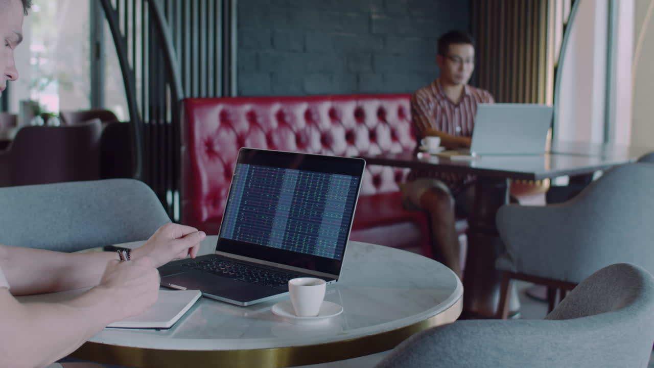 Caucasian Businessman Preparing Financial Report on Laptop