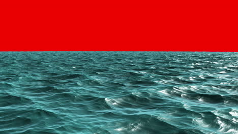 Choppy blue ocean under red screen sky 