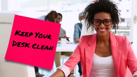 Animation-of-keep-your-desk-clean-text-over-african-american-businesswoman-using-computer