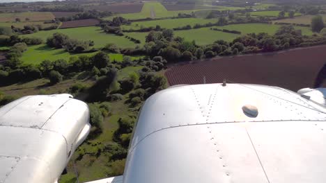 Aerial-view-of-a-PA-34-Senica-aircraft-landing-at-Stapleford-Airport,-Essex,-UK