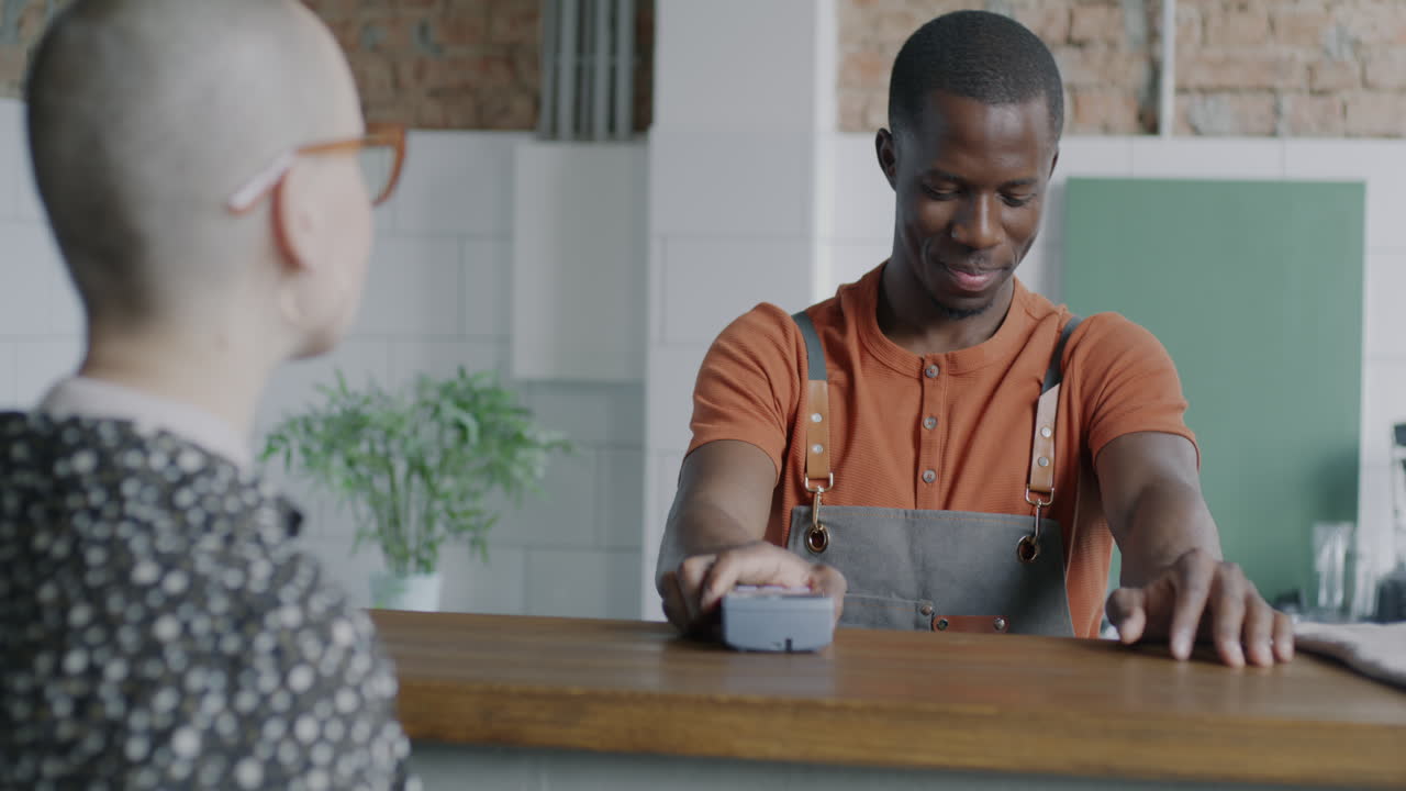 Customer Ordering Coffee at a Cafe