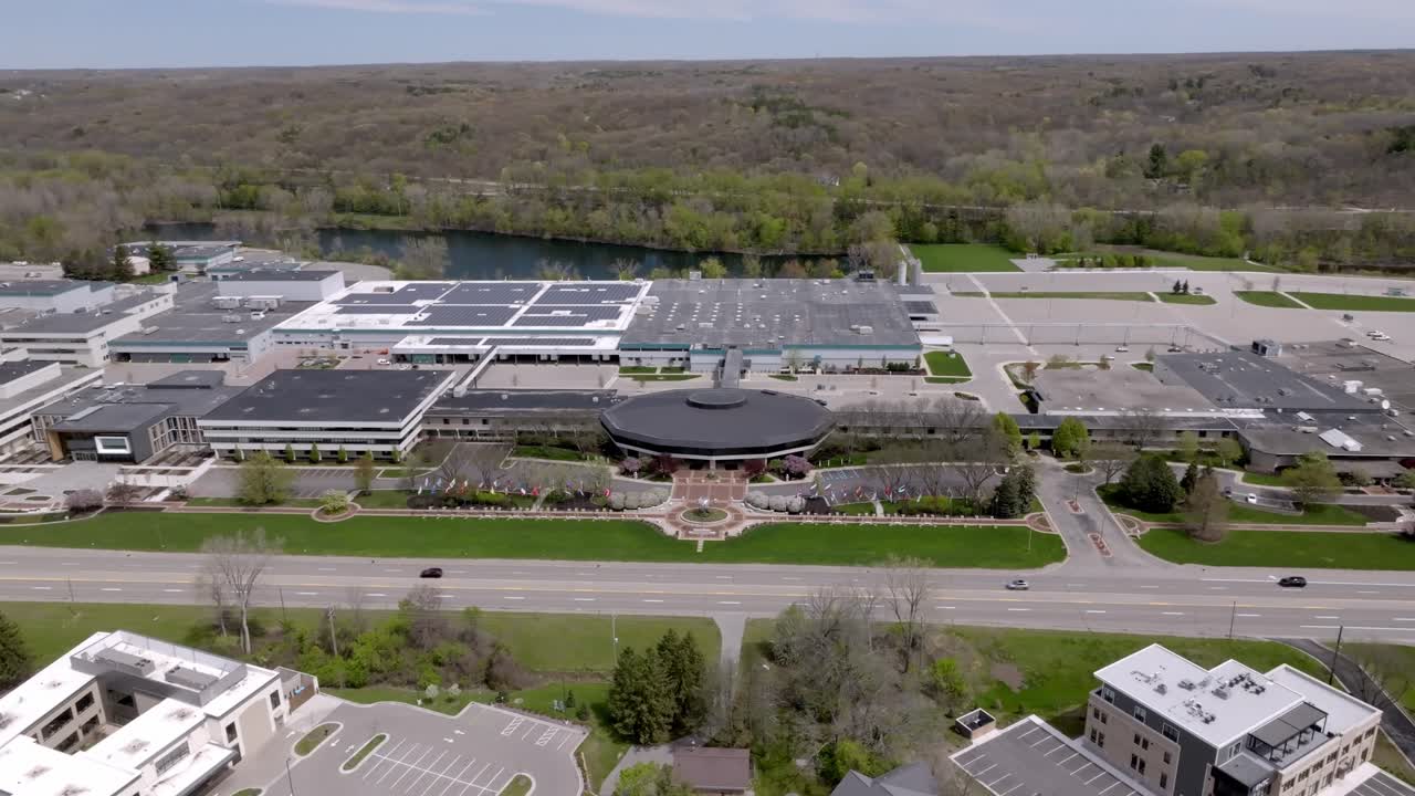 Amway North American Headquarters building in Ada, Michigan with drone video moving in a circle.