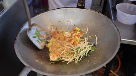 cooking noodles with vegetables and shrimp.