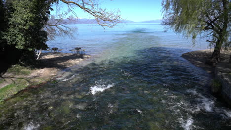 Black-Drim-river,-springs-outlet-into-Lake-Ohrid,-North-Macedonia,-sunny-day