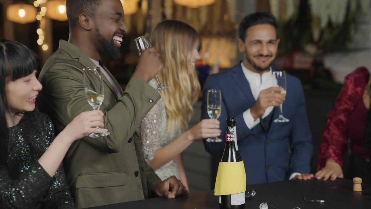 Tracking Shot of Friends Bringing Their Drinks Together On New Years