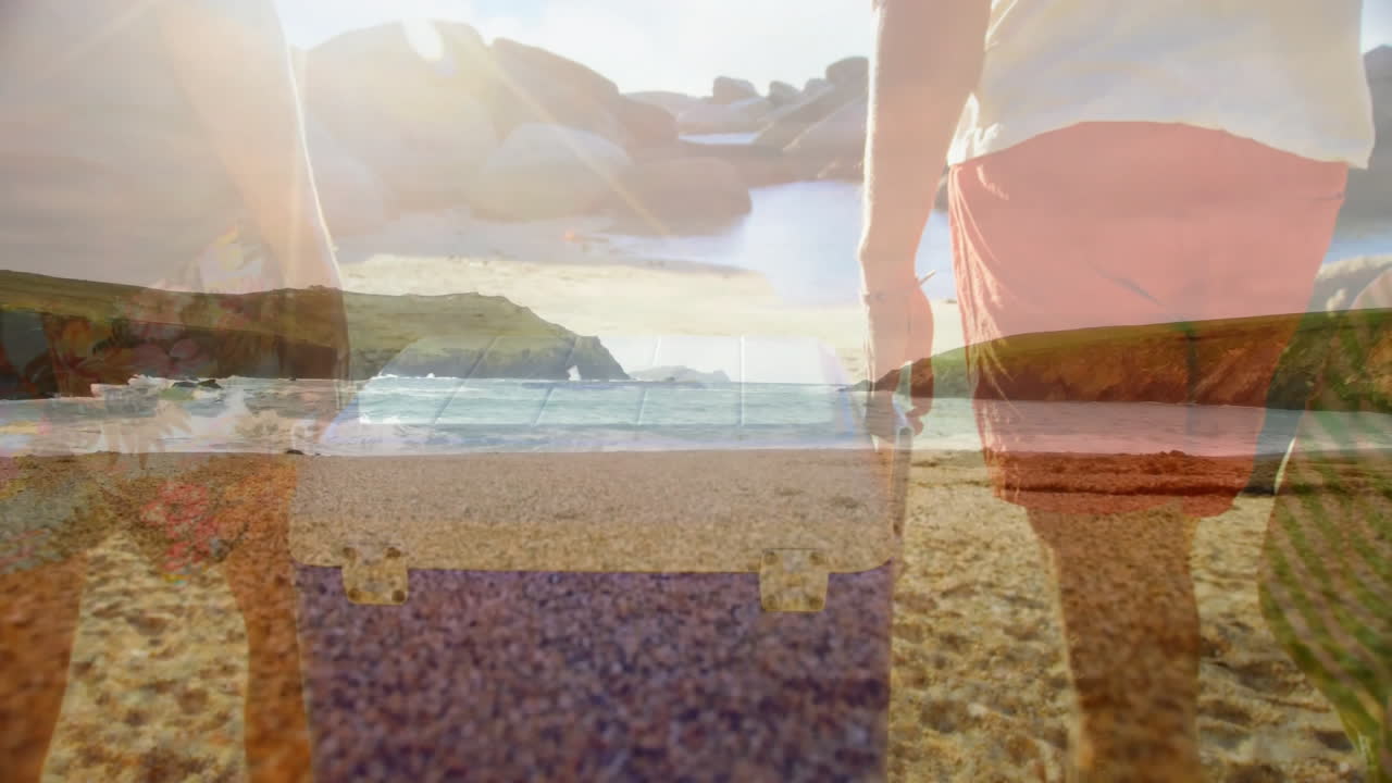 Walking on beach, two people enjoying scenic ocean view in background