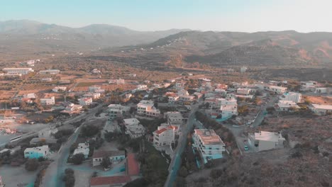 Drone-flying-over-small-town-in-Greek-city