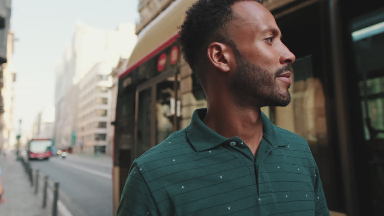 Man standing near a bus