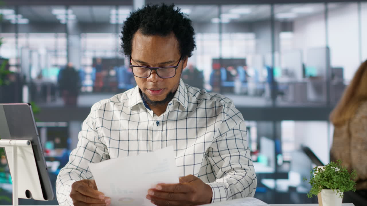 Man reading documents in office
