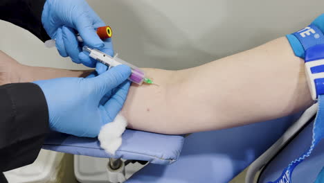 capture of a woman having her blood drawn for testing