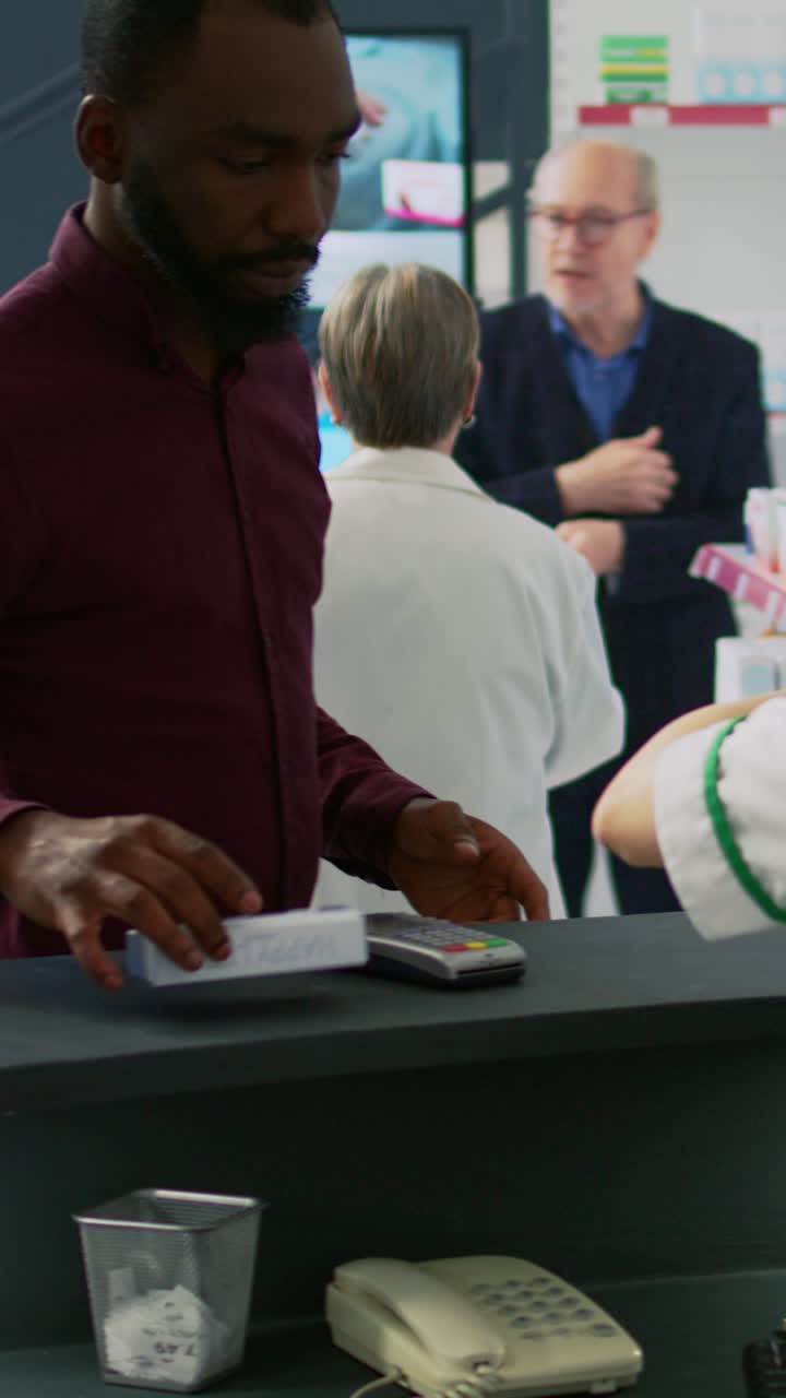 Vertical video: African american client approaching pharmacy counter to buy pills