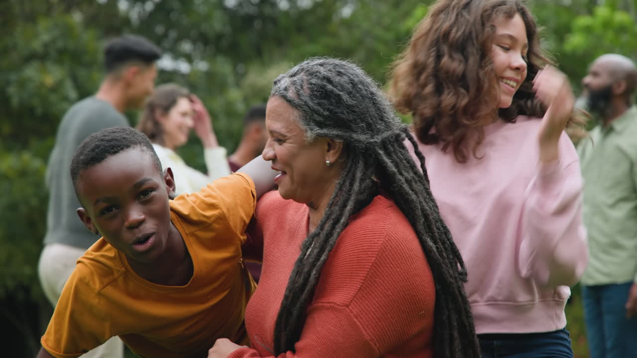 Family enjoying playful outdoor moments together, smiling and bonding in nature