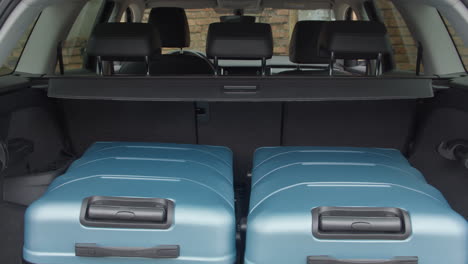 travel and camping luggage packed in the car trunk