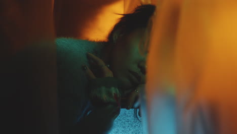 portrait of beautiful asian girl leaning on old tv with static noise