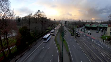 traffic skyline view at sunset next to woluwe park and brussels tram museum on the avenue de tervueren - belgium