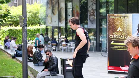 performer juggling fire torches outdoors