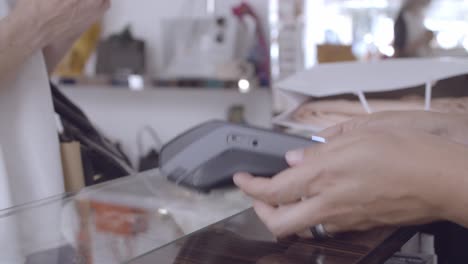 customer paying by credit card in store