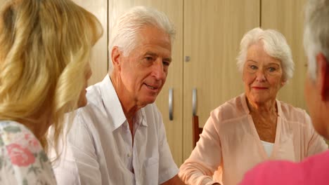 group of senior friends interacting with each other