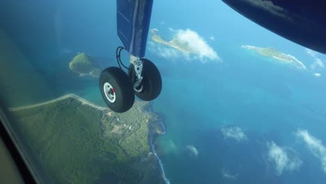 enjoying the views in a small propeller plane flying over the caribbean island of grenada