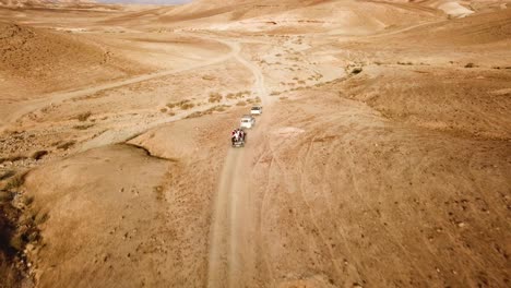 a group of travelers going through the desert