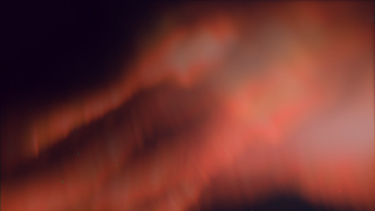 A stunning aurora borealis, or northern lights, is displayed in the sky. This natural phenomenon occurs due to solar wind interacting with Earth's magnetic field