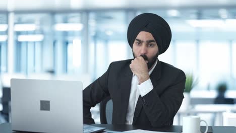 Confused-Sikh-Indian-businessman-thinking