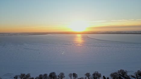 golden hour by the great lakes during winter time and sunset