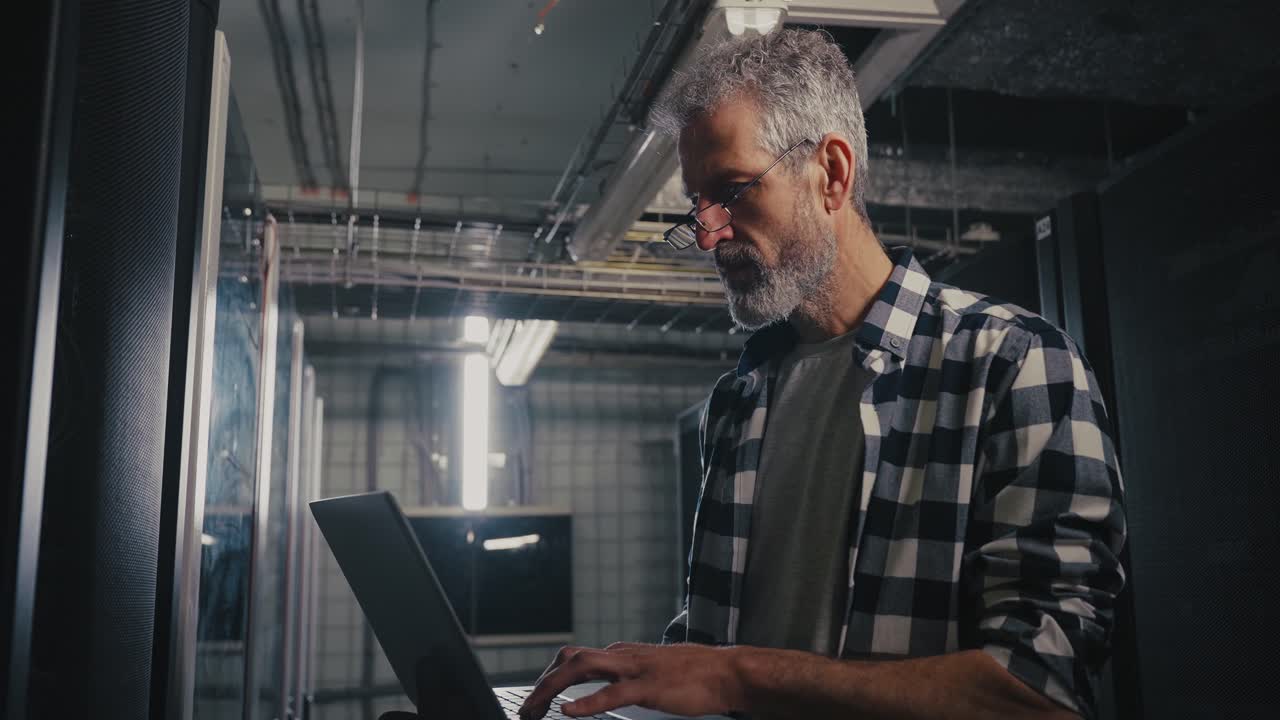 IT Technician working in a server room