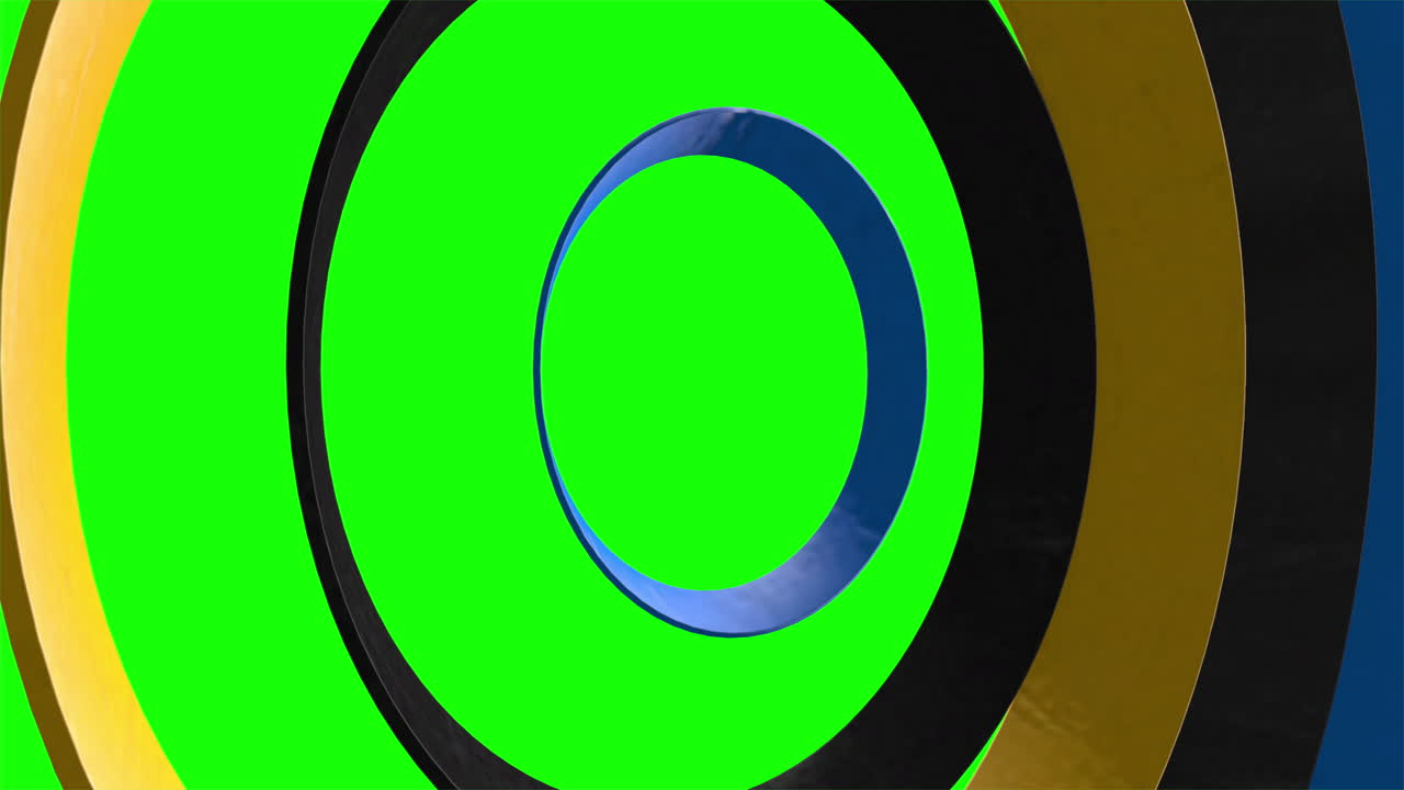 anillos amarillos y azules negros girando y pulsando, girando sobre fondo de pantalla verde