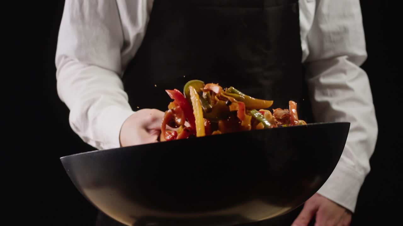 Chef Stir-Frying Shrimp and Vegetables in Wok