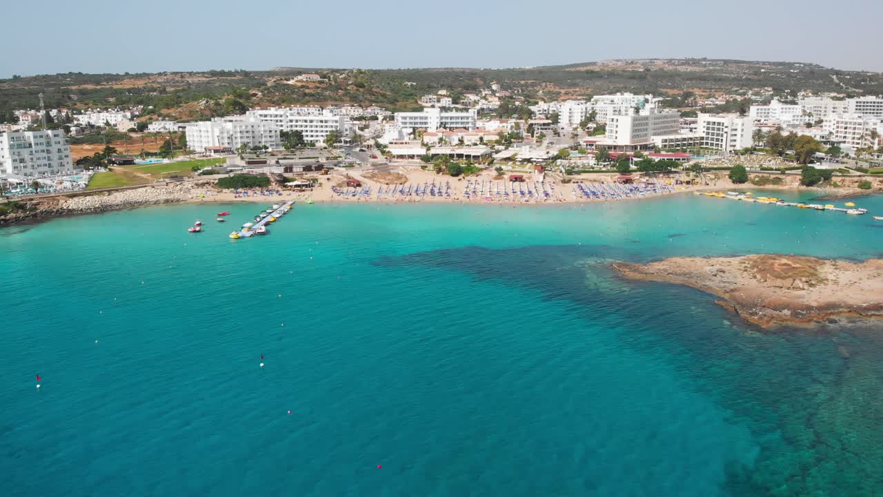 Fig tree bay beach at daylight with little island in front. Protaras, Cyprus