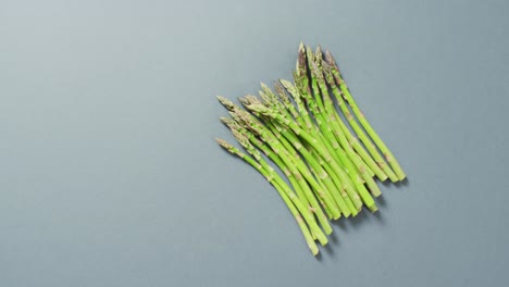 Video-of-fresh-asparagus-with-copy-space-over-grey-background