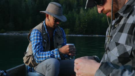 two fishermen preparing for fishing in the boat 4k