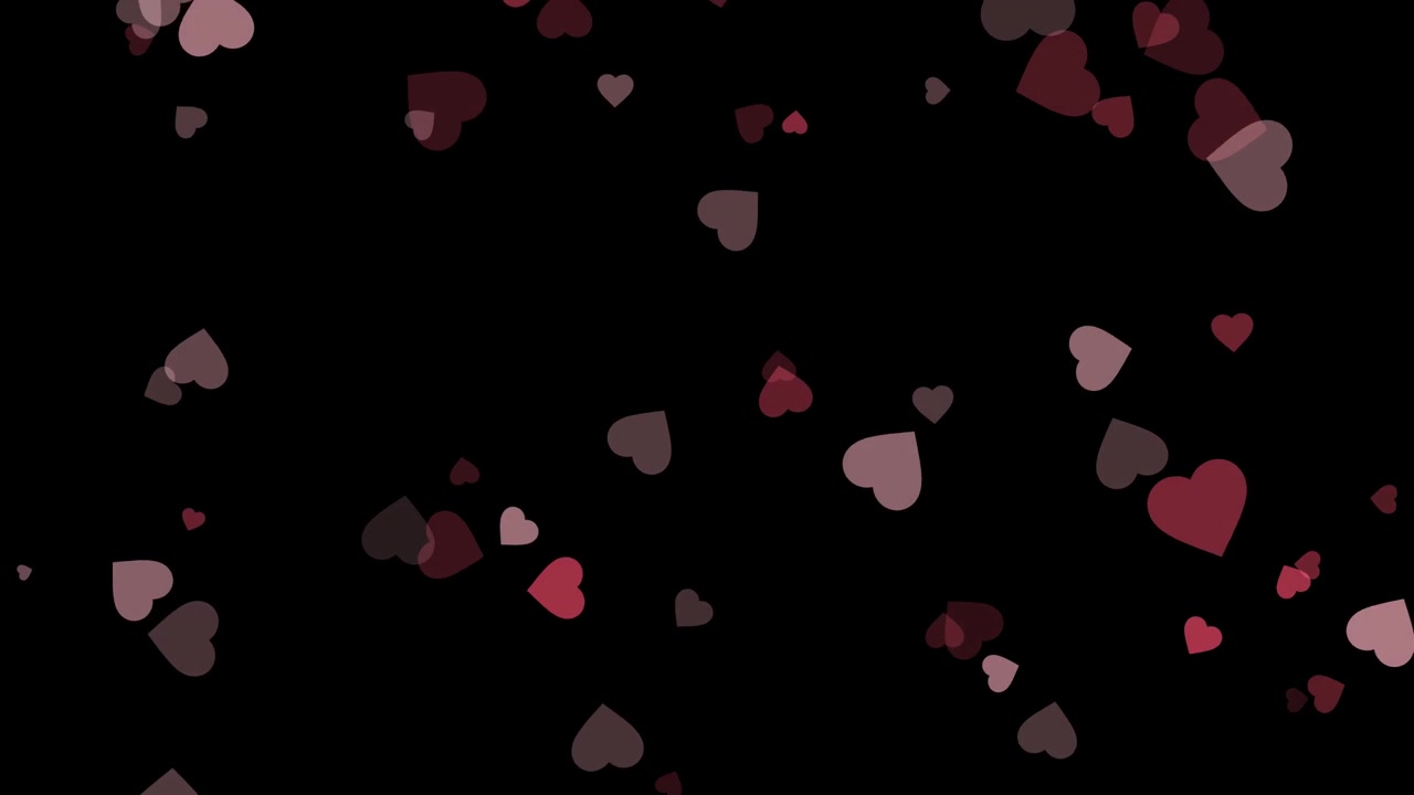 Cuori rossi e rosa fluttuanti su sfondo nero