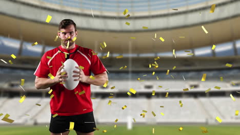 jugador de rugby profesional de pie frente a un estadio con confeti cayendo