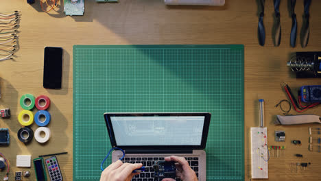 top view software engineer hands coding  at desk from above - red epic dragon