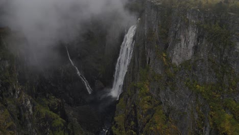 areal footage of vøringfossen waterfall in western norway in autumn