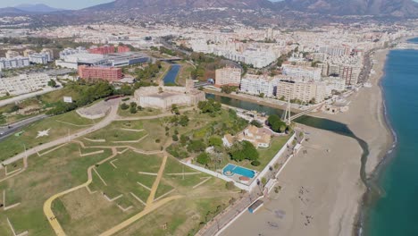 Aerial-sunny-day-view-of-historic-seaside-castle-in-the-suburbs-of-Fuengirola,-Spain