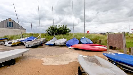 boats and equipment on a sandy beach