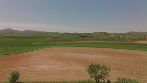 aerial view of a rural landscape with farmland and hills