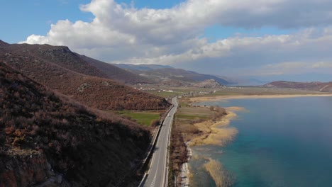 beautiful lake colorful landscape, turquoise water and golden reeds alongside panoramic road