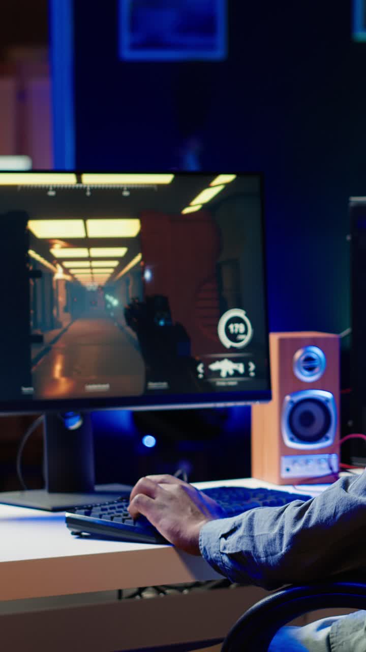Vertical video Man arriving at home to play FPS videogame on PC screen