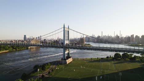 long dolly drone shot of new york's randall's island, triboro bridge, manhattan skyline
