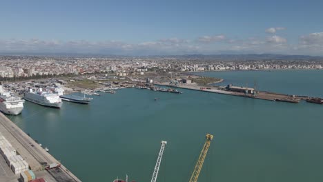 Aerial-pan-from-Durres-Container-Port-to-beach-waterfront-on-Adriatic