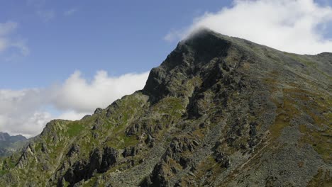 beautiful footage of krivan mountain with white cloudly sky above in slovakia - wide shot