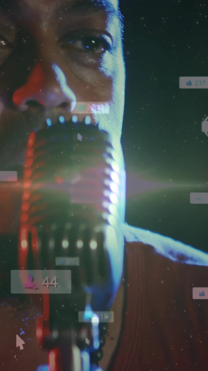 Vertical video: Shot shifting, vocalist leaning into mic, singing for stream while overlays moving